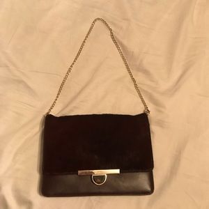 Dkny burgundy cowhide and leather purse.